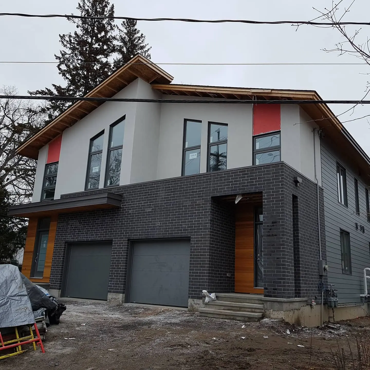 Modern two-storey home with a white and dark finished exterior